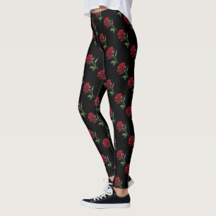 Crimson auf Ebenholz: Die einzelne rote Rose Leggings