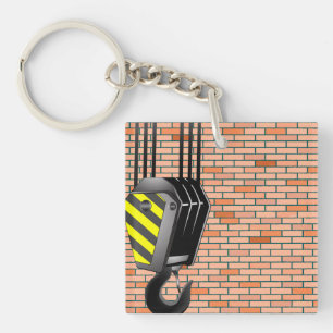 Crochet de grue industrielle avec mur de briques