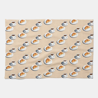 croissant on a plate with a cup of black coffee geschirrtuch