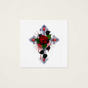 Croix d'argent avec une rose rouge
