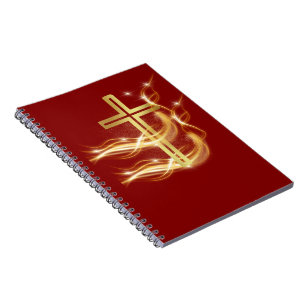 Croix dorée radiante élégante sur cahier rouge fon
