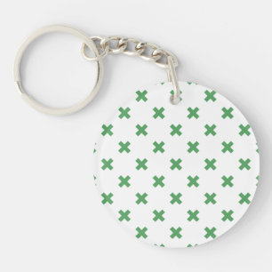 Croix verte coutures sur blanc