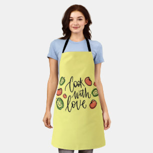 Cuire avec tablier de design d'amour