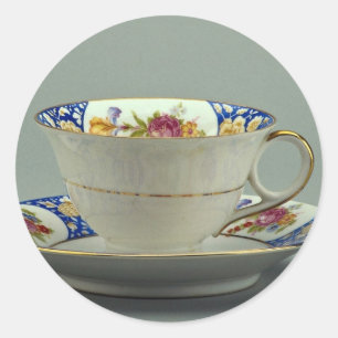 Cup und Untertasse mit farbenfrohen Blume-Designs  Runder Aufkleber