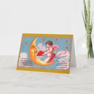 Cupid füttert Mond-Valentin mit Herz Feiertagskarte