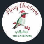 Custom Christmas Hummingbird Runder Aufkleber<br><div class="desc">Dieser personalisierte Weihnachtsaufkleber ist mit einem handillustrierten Kolibri ausgestattet,  der eine Weihnachtsmannmütze trägt. Fügen Sie Ihren Geschenken,  Briefen oder Zuhause-gefertigten Waren eine einzigartige Touch hinzu.</div>