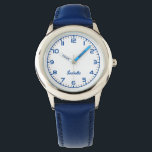 Custom Girls Name Blue Strap Armbanduhr<br><div class="desc">Custom Girls Name Blue Strap Watch. Die "Little Girl Timepiece", eine bezaubernde und anpassbare Uhr, die speziell für junge Mädchen entwickelt wurde. Die Uhr ist mit einem blauen Lederband ausgestattet, das sanft auf zarter Haut aufgesetzt ist, und einem sauberen, gut lesbaren Ziffernblatt mit spielerischen Ziffern. Das Highlight ist die Personalisierungsoption,...</div>