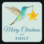 Custom Merit Christmas Hummingbird Square Sticker<br><div class="desc">Maßgeschneiderter Weihnachtsaufkleber mit einem leichten aquamarinen Kolibri mit Sternschmuck. Fügen Sie einfach Ihren Namen hinzu. Der Stil und die Größe des Schriftartes können Sie ändern,  indem Sie auf "Bearbeiten mit dem Designwerkzeug" klicken.</div>