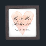 Custom Mr. Coral watercolor heart wedding ring Kiste<br><div class="desc">Custom Mr and Mrs. coral pink watercolor heart wedding keepsake gift box with magnetic lid. Add personalized name of bride and groom / newly weds. Vintage fern symbol background design with stylish script typography. Great for ring bearer, jewelry, party favor and other stuff. Also, Nizza for elegant engagement, Anniversary, bridal...</div>