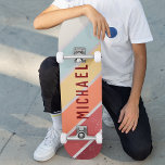 Custom Name Cool Retro Sunset Stripes Skateboard<br><div class="desc">Custom Name Cool Retro Sunset Stripes Skateboard feature your personalized name on a retro sunset stripes in burgundy, orange, yellow and blue on wooden background. Personalize by editing the text in the text box provided. Give a custom made gift, personalized skateboard to your favorite skateboarder for Christmas, birthday or your...</div>