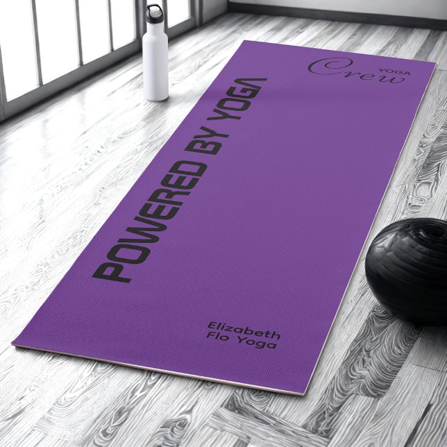 Custom Print Yoga Crew Royal Purple Yogamatte (Royal purple yoga mat on a studio floor.)