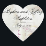 Custom White Floral Heart Shaped Wedding Stickers<br><div class="desc">Eine wunderschöne weiße Orchidee mit lila Akzenten schafft einen atemberaubenden herz=förmigen Hochzeitsaufkleber. Es erzeugt einen strukturierten und interessanten Hintergrund. Die Braut und der Bräutigam Vornamen sind eine der ersten und dann ihr Nachname. Es ist hilfreich für viele Leute zu wissen, ob ihr Nachname jetzt ist. Dann ist ihr Hochzeitstermin unten....</div>