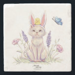 Cute Easter Cat with Chick Illustration Steinuntersetzer<br><div class="desc">Add a charming seasonal accent to your table with this stone coaster featuring a whimsical Easter cat illustration. The playful design shows a curious cat wearing bunny ears, with a tiny chick perched on its head and a butterfly fluttering nearby among delicate spring flowers. The scene captures the joyful spirit...</div>