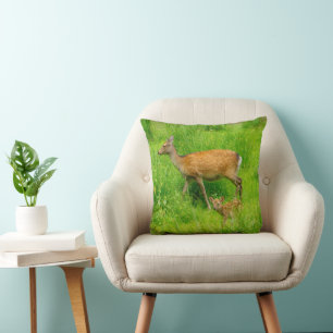 Cute fallow deer with young kissen