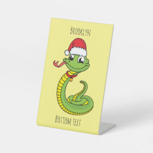 Cute green snake with santa hat cartoon sockelschild