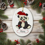 Cute Panda Bear Personalized Christmas Keramikornament<br><div class="desc">Here is an adorable personalized Christmas ornament for a young child. The front features a cute baby Panda Bear cartoon image. The bear is wearing a red and white Santa hat and nibbling on a striped candy cane. Below the image is a white scroll banner lined in red with your...</div>