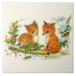 Cute Vintage Foxes Retro Christmas Fliese<br><div class="desc">Keramik Kachel mit einem schönen zeichn eines Fuchkopfes mit einem freundlichen Vogel in der Nähe. Umgeben von Pinienbäumen und anderen Winterpflanzen.</div>
