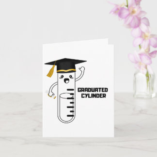 Cylindre gradué, carte de vœux pliée sur la scienc