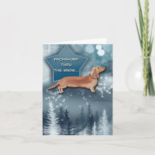 Dachshund à travers la carte de voeux de neige