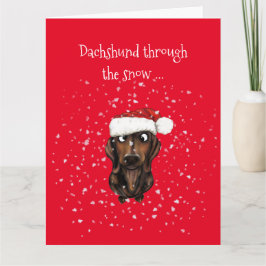 Dachshund à travers la neige ... Carte de Noël