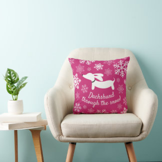 Dachshund à travers le Coussin de Noël rose neige