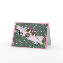 Dachshunde an Weihnachten in einem rosa Cabrio