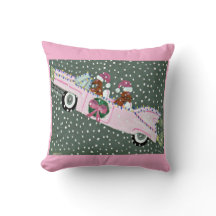 Dachshunde an Weihnachten in einem rosa Cabrio