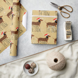 Dackel durch das Schneedeckungspapier Geschenkpapier