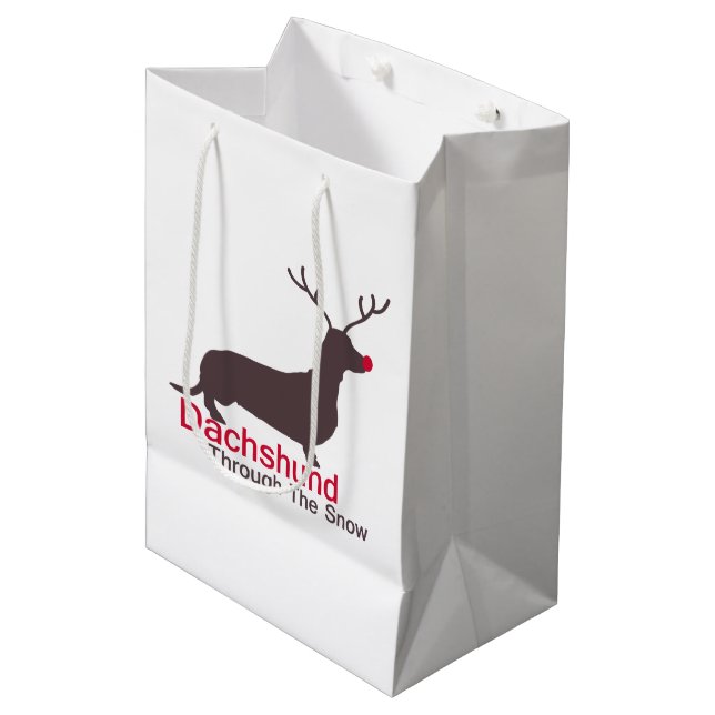 Dackel durch den Schnee Mittlere Geschenktüte (Vorderseite Schrägansicht)