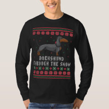 Dackel durch den schneebedeckten Weihnachtssüßer