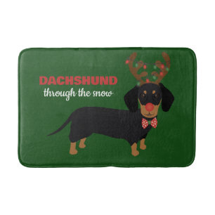 Dackel durch Schnee Niedliche Dackel Rentierhund Badematte