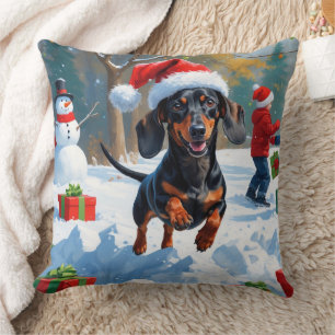 Dackel läuft im Schnee mit Weihnachtshut Kissen