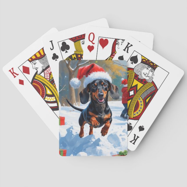 Dackel läuft im Schnee mit Weihnachtshut Spielkarten (Rückseite)