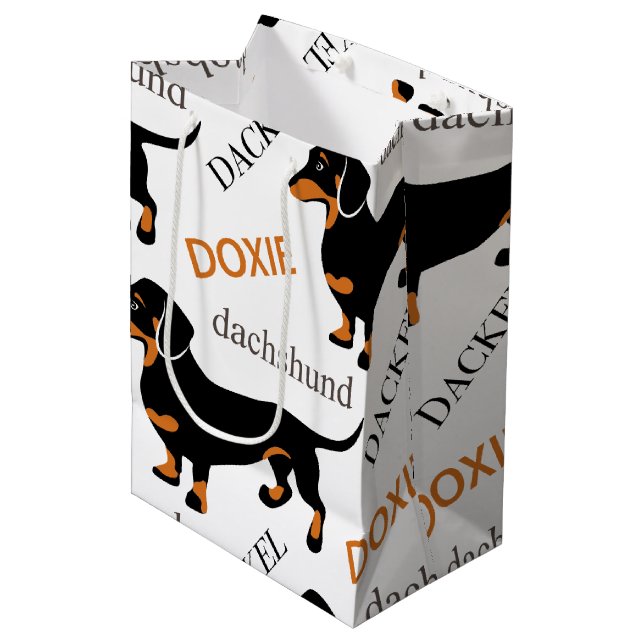 Dackel-Muster Mittlere Geschenktüte (Vorderseite Schrägansicht)