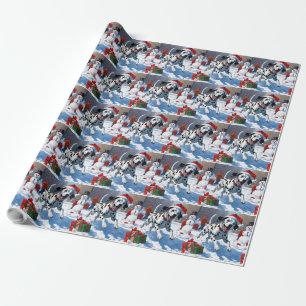 Dalmatiner läuft im Schnee mit Weihnachtshut Geschenkpapier