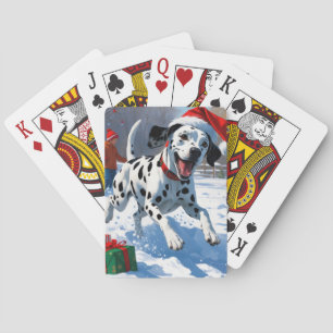 Dalmatiner läuft im Schnee mit Weihnachtsmütze Spielkarten