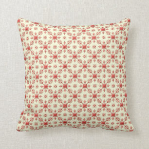 Damassé abstraite de rouge sur le coussin de crè