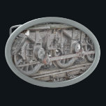 DAMTRAIN-RÄDER OVALE GÜRTELSCHNALLE<br><div class="desc">Ein Kunstdesign von Dampfzugrädern.</div>