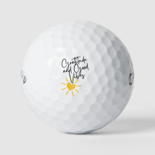 „Dankbarkeit und gute Vibes“ mit Herz-Sonne-Icon � Golfball