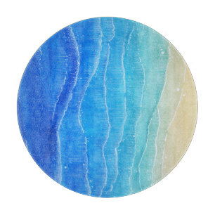 Das Meer und der Strand sind in Aquarellen gehalte Schneidebrett