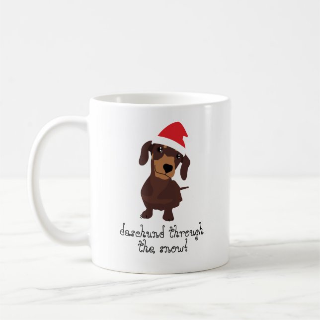 Daschund mignon par la tasse de Noël de neige (Gauche)