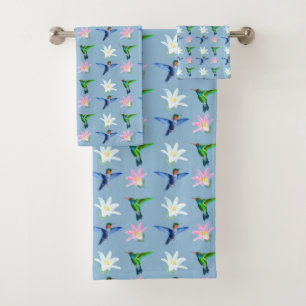 De beaux colibris et fleurs sur fond bleu clair