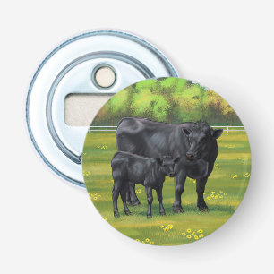 Décapsuleur Vache d'Angus noir et veau mou en pâturage d'été