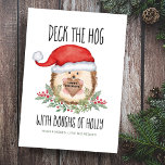 Deck den Hog Igel Santa Holly Weihnachten<br><div class="desc">Teilen Sie sich einen Spaß mit dieser Weihnachtskarte für Waldtiere mit einem niedlichen Aquarell-Igel in einer Weihnachtsmannmütze, die von Hufeisen und Beeren gerahmt ist und ein rustikales Holzschild trägt. In Caption steht "Deck the Hog with Boughs of Holly". Gruß im Holzschild (mit Happy Holidays gezeigt) kann personalisiert werden. Kunst von...</div>