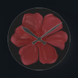 Deep Crimson Moody Bloom Glossy Dark Botanical Flo Runde Wanduhr<br><div class="desc">Embrace the drama of nature with this deep crimson bloom. This striking digital illustration features a bold red flower with a high-gloss, almost porcelain finish, set against a deep, moody background. Perfect for lovers of dark botanical art, gothic garden aesthetics, and moody floral decor. This piece captures a sense of...</div>