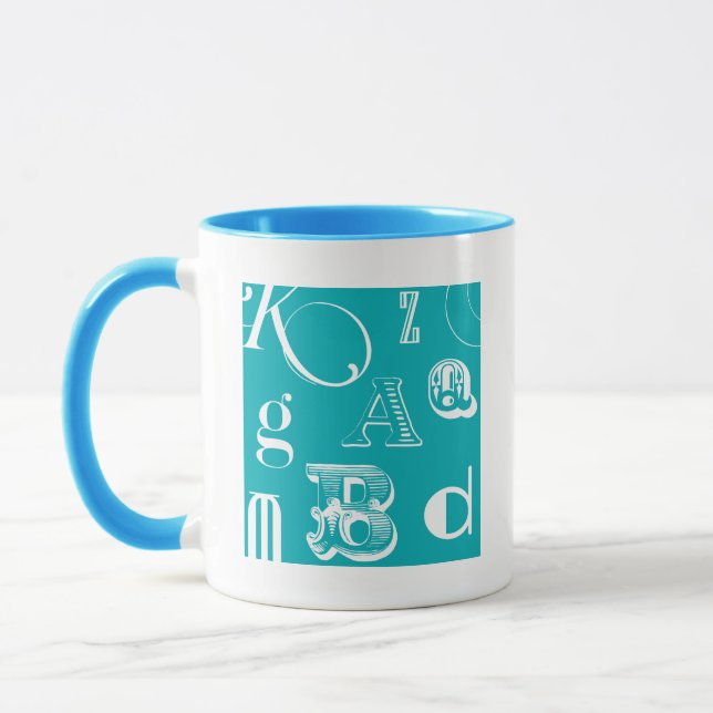 Dekorative Buchstaben auf blauem Hintergrund Tasse (Links)