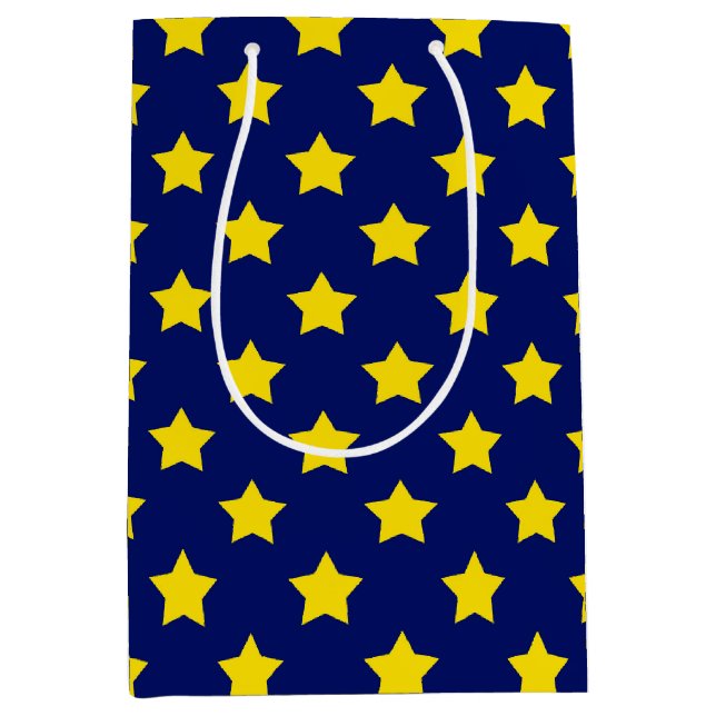 Dekoratives Muster aus blaugelben Sternen Mittlere Geschenktüte (Vorderseite)