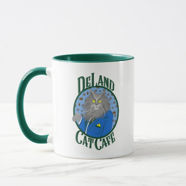 DeLand Cat Cafe's Henry DeCat in blauen Anzug Logo Tasse (Links)