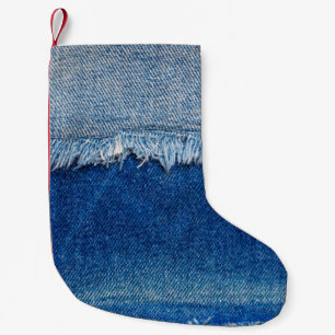 Denim Jeans Hintergrund. Denim-Rippstoff mit b Kleiner Weihnachtsstrumpf