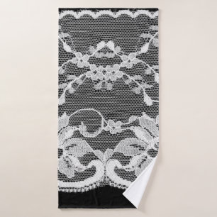 Dentelle florale blanche sur un arrière - plan noi